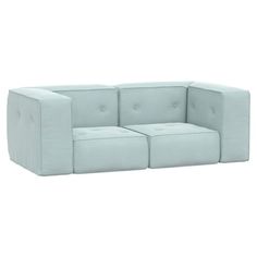 a white couch with four square cushions