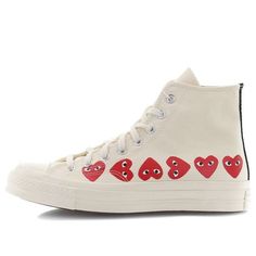 The iconic Chuck Taylor silhouette gets a luxurious upgrade with the Comme des Garcons Play x Chuck 70 Hi Top Multi Heart. This high top sneaker features a premium canvas upper in an off white hue, with shiny metal eyelets, double stitching, and Comme des Garcons heart icons on the sidewall for a signature touch. A vulcanized rubber midsole and rubber outsole complete the vintage look and feel of this must-have sneaker. Chuck Taylor Outfit, Heart Converse, Cdg Converse, Converse Play, Converse Comme Des Garcons, Play Converse, Garcons Converse, Comme Des Garcons Converse, Logo Wear