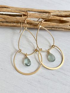 Faceted moss aquamarine briolettes wire wrapped to a gold filled light chandelier frame. This is a super light, comfortable, airy pair of earrings. Gemstone size 5mm Earring total length 2 inches Perfect every day earrings. Available finish: Gold Filled or Sterling Silver Please make your selections at the finish tab. Processing time: 1 day Please visit my full collection of EARRINGS: https://www.etsy.com/shop/YaniaJewelry?ref=seller-platform-mcnav&search_query=earrings Follow us on Instagra Gold Dangle Teardrop Earrings For May Birthstone, Gold Wire Wrapped Briolette Teardrop Earrings, Gold Wire-wrapped Briolette Teardrop Earrings, Teardrop 14k Gold Filled Chandelier Earrings As Gift, Handmade 14k Gold-filled Teardrop Chandelier Earrings, Handmade Teardrop 14k Gold Filled Chandelier Earrings, Handmade Teardrop Chandelier Earrings In 14k Gold Filled, Teardrop Chandelier Earrings In 14k Gold Filled For Gift, Teal Chandelier