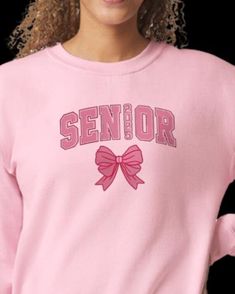 Celebrate your senior year in style with this cozy embroidered sweatshirt, perfect for the Class of 2025! Made from high-quality, soft material, this sweatshirt features 'Seniors 2025' beautifully stitched across the chest, making it a must-have for any graduating senior. Available in multiple colors and sizes, it's great for everyday wear, school events, or as a memorable keepsake. Whether you're buying it for yourself or as a gift for a senior, this sweatshirt is a comfortable and stylish way School Crew Neck Sweatshirt, Pink Crew Neck Sweatshirt For School Spirit, Pink College Sweatshirt With Embroidered Logo, Pink Embroidered College Sweatshirt, Pink Embroidered Tops For College, Seniors 2025, Senior Year Things, Senior Sweatshirts, Class Of 2025