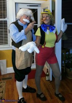 an older man and woman dressed in costumes