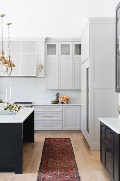 a large rug in the middle of a kitchen