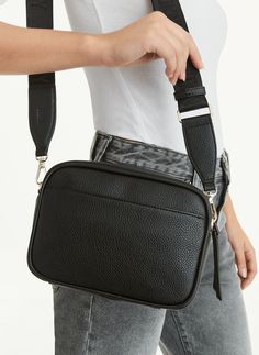 8.5" L x 3" W x 6" H Crossbody Zip closure DKNY logo at front Interior and exterior pockets Lined Faux Leather Origin: Imported Style: R33EAA61 | DKNY Zoie Camera Bag in Black Dkny Logo, Donna Karan, Camera Bag, Interior And Exterior, Faux Leather, Exterior, The Originals, Leather, Black