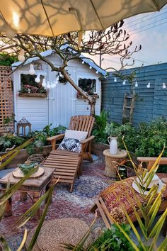 an outdoor patio with chairs, tables and potted plants