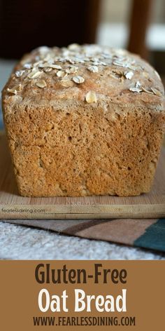 a loaf of gluten - free oat bread sitting on top of a cutting board