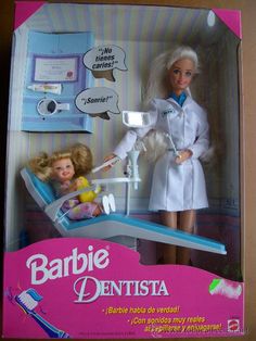 the doll is in its box and has a dentist's chair