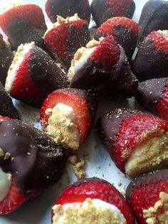 chocolate covered strawberries are arranged on a white platter with crumbs and sprinkles