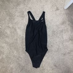 Never Worn Before Black Nike Swimsuit!! Size 14 Or Medium Nike Summer Pool Bodysuit, Nike Beach Swimwear, Nike Stretch Bodysuit For Beach, Nike Sporty Swimming Bodysuit, Nike Sleeveless Bodysuit For Beach, Nike Solid Color Bodysuit For Swimming, Nike Stretch Bodysuit For Swimming, Nike One-piece Swimwear For Sports, Nike Nylon Swimwear For Summer