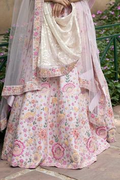 Blush pink raw silk lehenga with attached cancan and all-over floral motifs, 12 silken threads and cutdana- dabka work. Comes with zardozi-sequin embroidered padded blouse and two dupattas.
Component: 4
Embroidered
Neckline: Leaf
Sleeve Length: Half
Fabric: Lehenga and Blouse: Raw Silk;  Dupatta: Net; Lining: Cotton Shantoon
Color: Pink
Tassel tie-up back - Aza Fashions Pink Floral Embroidered Semi-stitched Lehenga, Pink Raw Silk Embroidered Fabric For Reception, Pink Raw Silk Fabric With Embroidery For Reception, Pink Chanderi Lehenga With Intricate Embroidery, Pink Raw Silk Set With Floral Embroidery, Pink Raw Silk Dress With Dupatta, Pink Embroidered Raw Silk Sets, Raw Silk Pink Sharara With Intricate Embroidery, Pink Raw Silk Sharara With Intricate Embroidery