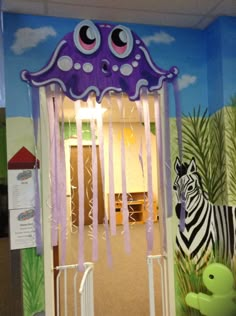 a room decorated with an octopus and zebra theme