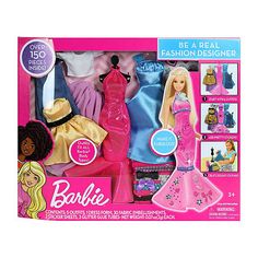 the barbie doll is in its pink box with clothes and accessories for her to wear