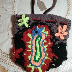 This Beautiful Shoulder Mesh Bag Sack Is One Of A Kind, All Handmade. Hand Crochet Primitive Art Titled "Floral Fantasy". Signed By Artist On Attached Tag. The Bag Is Unlined And Measures 12" Tall And 11" Wide Approx, Lying Flat. The Bag Stretches. Strap Drop Measures Approx 17" When The Top Is Pulled Together In Closed Position. Will Ship Within 1 Business Day. Handmade Rectangular Crochet Bag For Festival, Handmade Crochet Tote Bag For Festivals, Bohemian Brown Hand-knitted Shoulder Bag, Bohemian Hand-knitted Brown Shoulder Bag, Bohemian Brown Hand Knitted Shoulder Bag, Artisan Crochet Tote Bag For Festivals, Handmade Artisan Crochet Bag For Festival, Black Square Crochet Bag Bohemian Style, Brown Crochet Shoulder Bag For Festivals