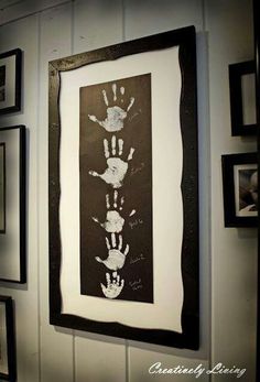 a black and white photo with hand prints on it