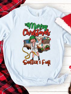 Embrace the jolly humor of the holiday season with our Shitters Full T-shirt! This Merry Christmas Shirt combines festive cheer with a touch of irreverence, featuring the iconic phrase 'Shitters Full' to add a dash of humor to your celebrations. Crafted from soft, comfortable fabric, it's perfect for spreading laughter at holiday gatherings. Whether you're a fan of classic holiday movies or just love a good laugh, this Funny Xmas Shirt is a must-have addition to your festive wardrobe. Spread the Funny Christmas Print Tops, Snarky Christmas Shirts, Funny Winter Holiday T-shirt, Funny Christmas Shirts Inspire Uplift ⭐, Classic Holiday Movies, Funny Long Sleeve Christmas T-shirt, Funny Xmas, Merry Christmas Shirts, Xmas Shirts