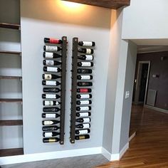 a wine rack is mounted to the wall