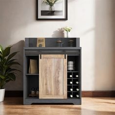 a wooden cabinet sitting next to a potted plant on top of a hard wood floor