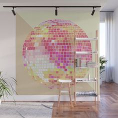 a room with a large wall mural in the shape of a disco ball