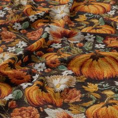 an orange and black fabric with pumpkins on it