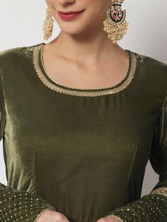 This is a beautiful 2 piece suit set. It comes with anarkali style kurta has gota, zari & sequin detailing, 3/4th sleeves, round neck, calf length teamed net dupatta with zari & stone detailing.The entire set has heavy lace detailing. 2 piece set Color- Green Work- Gota, Sequin & Zari Detailing Kurti Length - 50 inch Kurta Fabric-Velvet Dupatta Fabric-Net Sleeves-3/4th Sleeves Neck-Round Neck Care - Dry Clean Note - The set does not include potli bag Velvet Anarkali, Net Sleeves, Velvet Dupatta, Green Anarkali, Floor Length Anarkali, Salwar Pants, Potli Bag, Kurti Neck, Sequin Patch