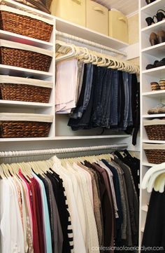 the closet is full of clothes, shoes and other items to fit well in it