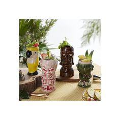 there are many different vases sitting on the table with fruit and drinks in them