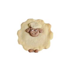 a sheep with a hat on it's head is shown in the shape of a pie