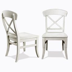 two white chairs sitting next to each other on a white surface with one chair missing the seat