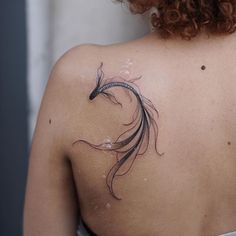 a woman with a tattoo on her back