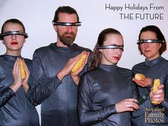 three people wearing futuristic glasses and holding corn on the cob in front of them