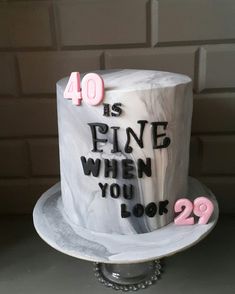 a birthday cake with the words 40 is fine when you look 22 on it's side