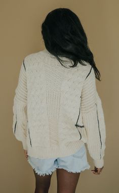 Looking for a cozy, chunky sweater that's unique and timeless? The Look After You Sweater is a crewneck cream colored sweater with black piping detail throughout and fun contrasting knit patterns. Dress her up with a leather mini and boots or wear more casually with denim. Heather is 5’9” measurements: 52” bust | 28” length PRODUCTS ON SALE ARE FINAL SALE! Feel free to email us at orders@shopriffraff.com or DM us with any questions regarding fit, styling, or our return policy in general. Patterns Dress, Cream Colored Sweater, Look After Yourself, Chunky Sweater, Leather Mini, Knit Patterns, Cream Color, Piping, Final Sale