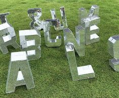 several pieces of metal sitting in the grass