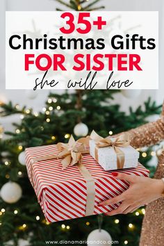 a woman holding a wrapped present in front of a christmas tree with the words, 35 christmas gifts for sister she will love