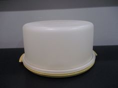 a white cake sitting on top of a black table