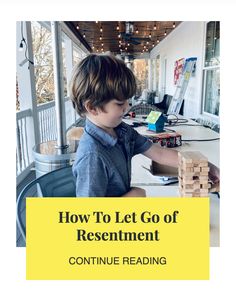 a young boy is playing with wooden blocks in front of a computer desk and the words how to let go of presentment