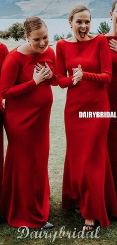 the bridesmaids are laughing together in their red gowns and dresses with long sleeves