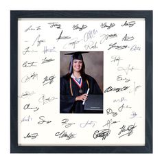 an autographed photo of a woman in graduation cap and gown