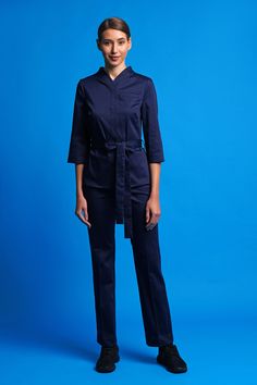 "A navy blue cotton jacket featuring high neckcollar, 3/4 sleeves and fabric belt. - high neck (stand collar) - semi-fitted silhouette - kimono style - matching fabric belt - 3/4 sleeves Fiber: cotton 95%, elastane 5 %  Color: navy blue Our model is 176cm/5'9\" tall You may feel free choosing the size. Just send us your measurements (bust, waist, hips, height). We will define your correct size." Cotton Blazer Women, Beautician Uniform, Navy Semi-formal Outerwear With Double Button Closure, Fitted Military Outerwear With Stand Collar, Chef Jackets Women, Women Chef, Navy Fitted Single-breasted Outerwear, High Neck Jacket, Tailored Navy Outerwear With Double-breasted Button Fastening