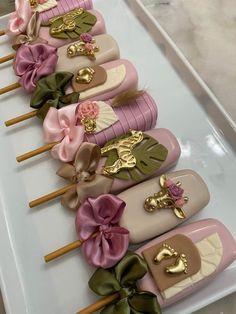 there are many different types of toothbrushes on the trays with bows and brooches