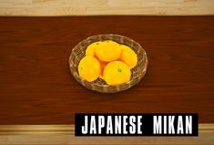 a basket full of lemons sitting on top of a wooden table next to a sign that says japanese mikan