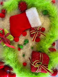 a wreath with christmas decorations on it