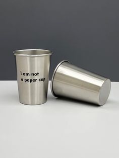 a stainless steel cup with the words i am not a paper cup printed on it