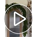 an image of a living room with a wreath on the door