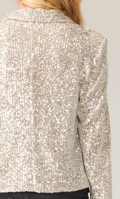 Sparkle and shine in this silver mini sequin jacket that sets the scene for you to steal the spotlight the moment you arrive. Sequin cropped blazer Draped collar Shoulder pads Cropped Lined Length: 20 3/4" Shoulder width: 14 7/8" Self: 100% Polyester; Lining: 100% Polyester Style #: G110J1524 Sparkle Suit, Draped Collar, Sequin Jacket, Womens Clothes, Cropped Blazer, Sherpa Jacket, Oversized Jacket, Wedding Attire, Modern Woman