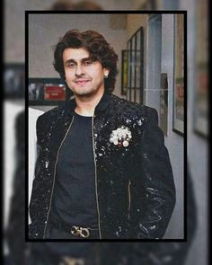 a man wearing a black jacket with sequins on it