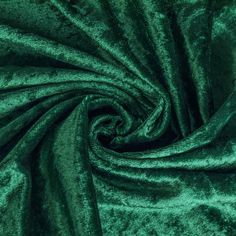 a green velvet fabric with very thin folds