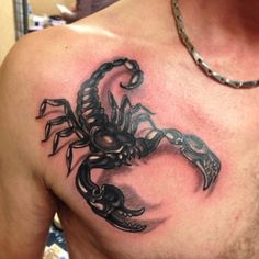 a man with a scorpion tattoo on his chest