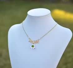 "2018 COLLECTION, ATHENA. A nature inspired necklace featuring white Dogwood with dangled on leaf metal branch. Perfect for spring wedding theme jewelry. Detail : - Hand sculpted flower made of Polymer Clay . Size approx: 16-17mm. - Gold plated over brass branch as pictured. - Cream Swarovski Pearls - Gold Plated over brass chain as pictured, Rose gold plated, silver plated available. - Entire length 16\" or 18\" + 2 extenders. Finish with lobster claw. - Made to order in 3-4 business days. If y Nature-inspired White Necklace For Wedding, Spring Wedding Theme, Wedding Themes Spring, Branch Necklace, Necklace Flower, Inspired Necklace, Swarovski Pearls, Brass Chain, Gold Plated Silver