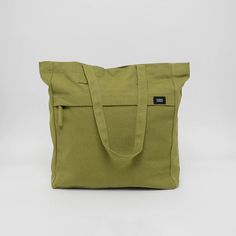 Made with 14 oz heavy duty organic cotton canvas GOTS certified, low impact dyes Lead-free YKK metal zippers Lead-free snap closure 11" drop strap 15L capacity, 16"H x 14"W x 4"G Front pocket: 10"H x 14"W Back pockets: H"H x 14"W with divider Bottle pocket: 4.5"H x 4"W Made in a Fair Trade Certified Factory Handcrafted in Kolkata, India The Executive Tote is large enough to fit all your office accessories, sturdy enough to stand on its own for easy loading, it’s a snap to open and close, and it’ Tote Bag With Pockets, Shopping Totes, Work Essentials, Work Tote Bag, Feeding America, Work Tote, Work Organization, Office Accessories, Laptop Sleeves