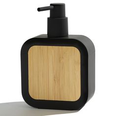 the soap dispenser is made out of wood and black